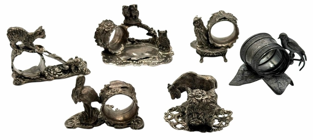 (6) Antique Napkin Rings: (6) Antique Napkin Rings. This lot contains a Meriden Britannia silver plate napkin ring. The napkin ring has a Victorian-style design with a bird on leaf motif. The napkin ring is stamped on the bott