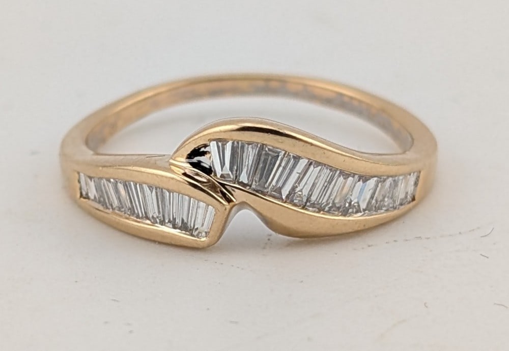 14K Gold Channel Baguette Diamond Contour Band: Nice 14K yellow gold contour band with channel set baguette cut diamonds. Ring is size 8 and weighs 3 grams.