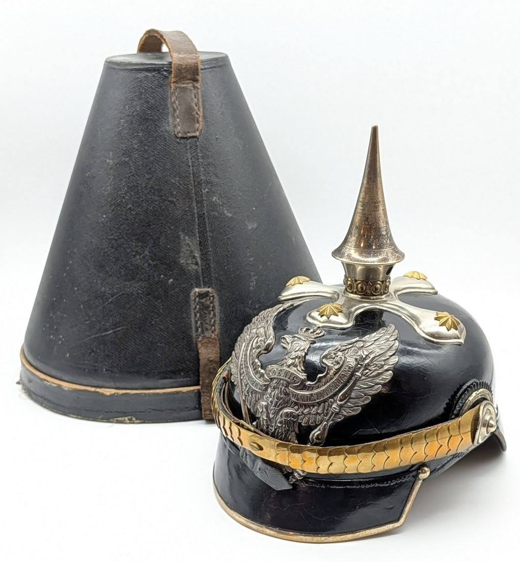 WWI Imperial German Prussian Pickelhaube Spike Helmet w/ Case: Features a the iconic spike top with a silver plated finish and star accents, a silver plate Imperial crest front plate, and a brass scaled chin strap. Helmet is in very nice condition with some crazi