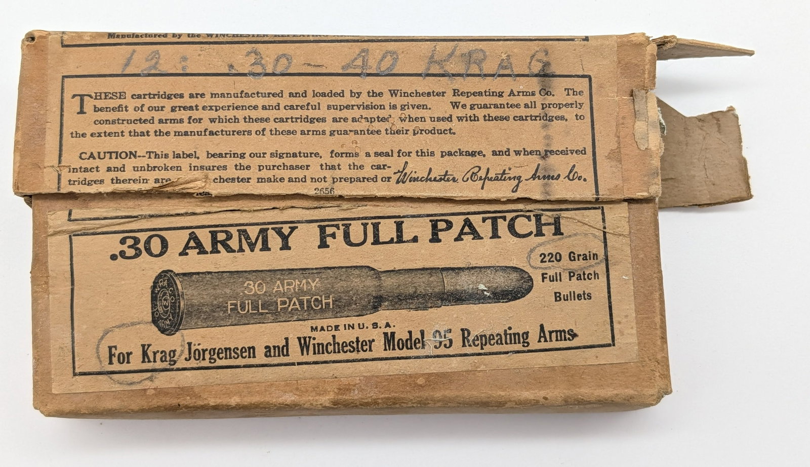 Partial Winchester .30 Army .30-40 Krag Cartridge Box: Box includes 11 original cartridges and 6 other brand added cartridges. Box is in fair aged condition with one side of the lid torn open, edge wear, and staining from storage and age.
