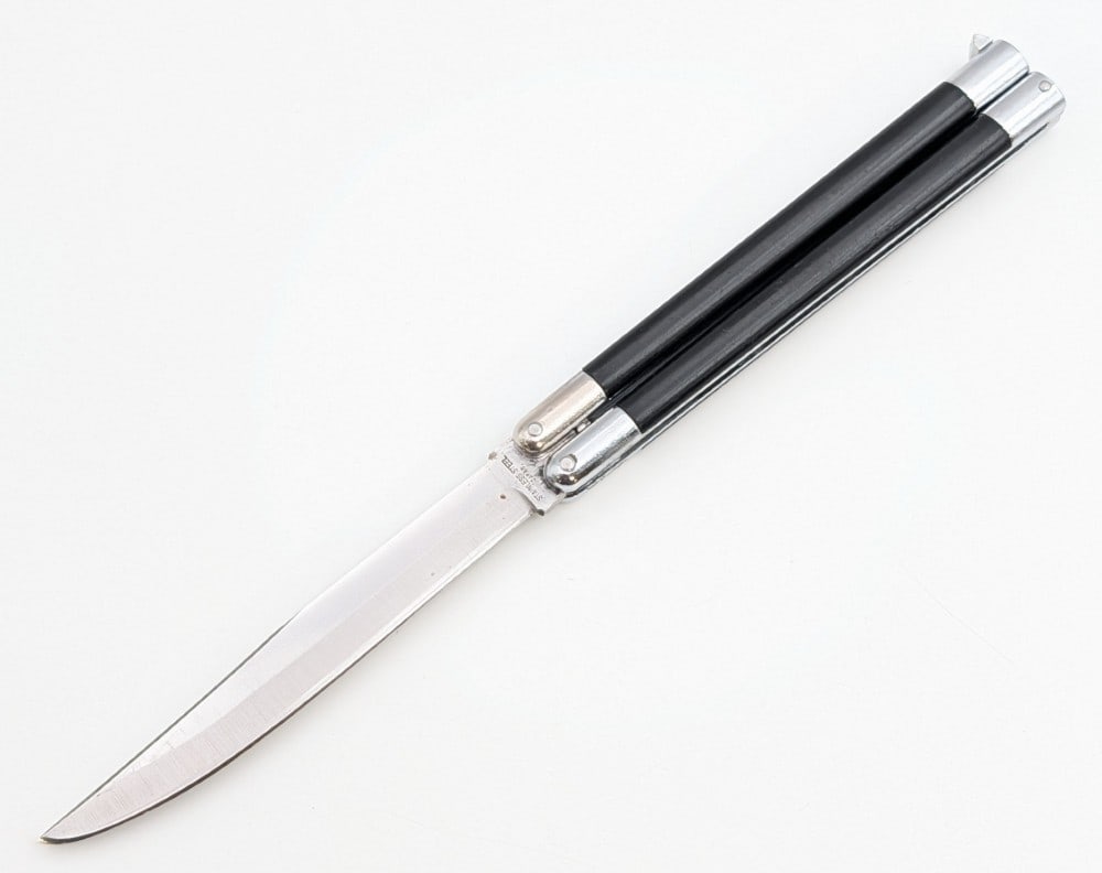 Vtg Japanese Stainless Balisong Butterfly Knife: Knife is in nice condition with light scratches on the blade, and light scuffs and dings on the bolsters and handle scales from handling. Overall measures 5-3/8in when closed.