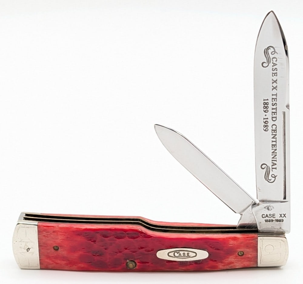 1989 Case XX Centennial Red Bone Long Pull Gunstock R6230: Knife is in good condition with some heavy scratched patterns on the bolsters, and other scratches from handling. Overall measures 4in when closed.
