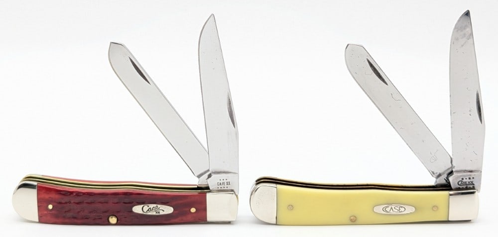 2001 & 23 Case XX Synth Yellow & Red Bone Trappers: Knives are in good condition with some carbon spotting on the blades, and scuffs and tarnishing on the bolsters. Overall measures 4-1/8in when closed.