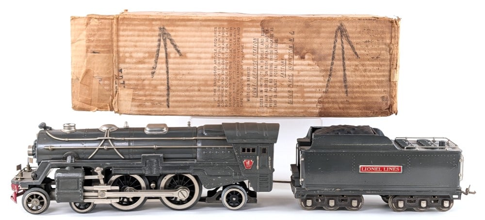 Prewar Lionel Standard Gauge 392E Locomotive and 392W Tender: Prewar Lionel standard gauge 392E locomotive and 392W tender in gunmetal gray. The engine has some paint touchup's mostly to the cab roof. Both would enhance from a detailed cleaning. They show some p