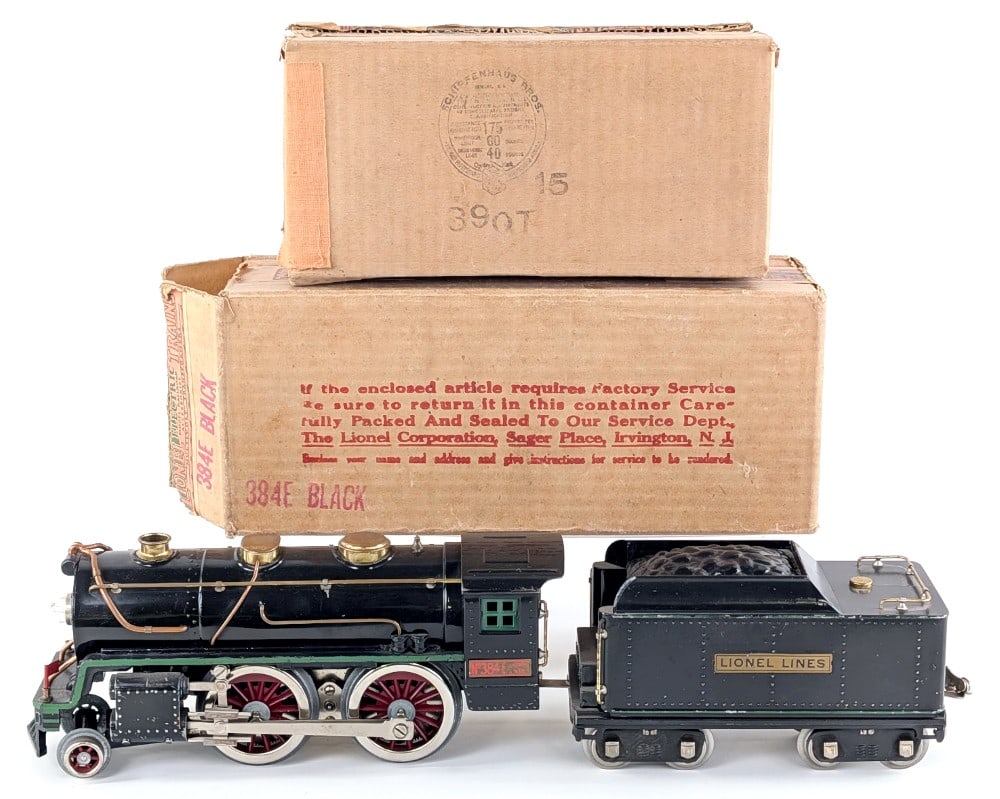 Prewar Lionel Standard Gauge 384E Locomotive (Black w/ Green Stripe) with 384T Tender: Prewar Lionel standard gauge 384E locomotive and 384-T tender with the original boxes. The locomotive is the black with green stripe variation. Both show some light paint loss and wear from age. The l