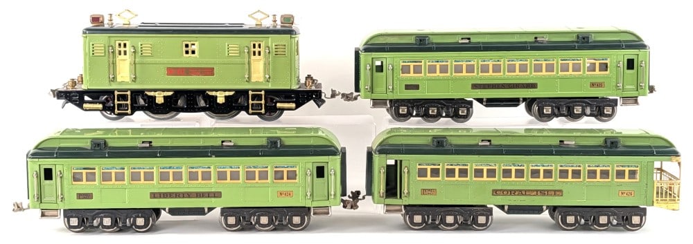 Lionel Standard Gauge 9E Locomotive and Stephen Girard Passenger Cars Set: Lionel standard gauge two tone green 9E locomotive, 424 Liberty Bell, 425 Stephen Girard, and 426 Coral Isle passenger cars. The locomotive has replacement parts. The cars show some scratches and wear