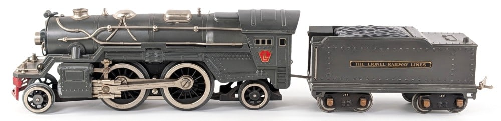 Lionel Standard Gauge 385E Locomotive with Tender: Prewar Lionel standard gauge gray 385E locomotive with tender. The loco is missing the flags. Both have some dust and could use a detailed cleaning.