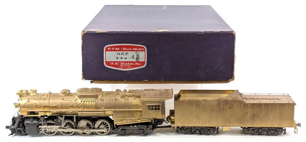 KTM Brass O Scale NKP 2-8-4 Berkshire Loco w/ Tender: KTM brass O Scale Nickel Plate Road 2-8-4 Berkshire locomotive with tender. The tender has bent rear steps that are missing the support bar. Shows some tarnishing to the brass finish with dust and wea