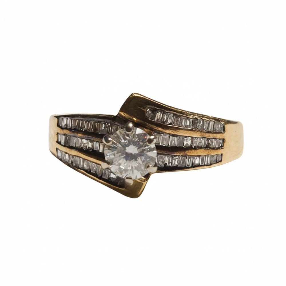10kt Yellow Gold Baguette Diamond Engaement Ring: The ring is a size 6.5. The diamonds are a total of 1cttw. The ring weighs 3.79 grams.