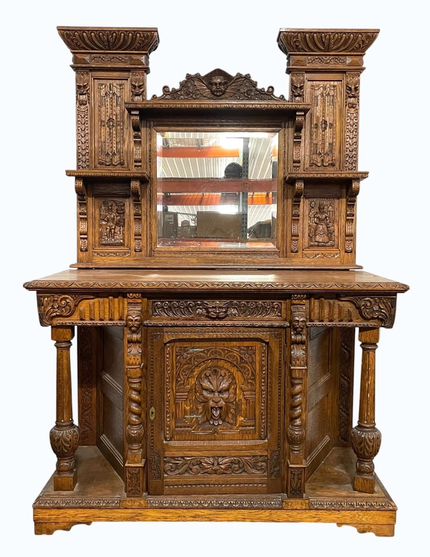 Antique Hand Carved Gothic/Renaissance Buffet w/ Mirror: Antique Hand Carved Gothic/Renaissance Buffet w/ Mirror. Hand Carved Griffin, Knight, and More Intricate Designs on Buffet and More. Buffet is in overall good condition with some Edge Ware with Trim