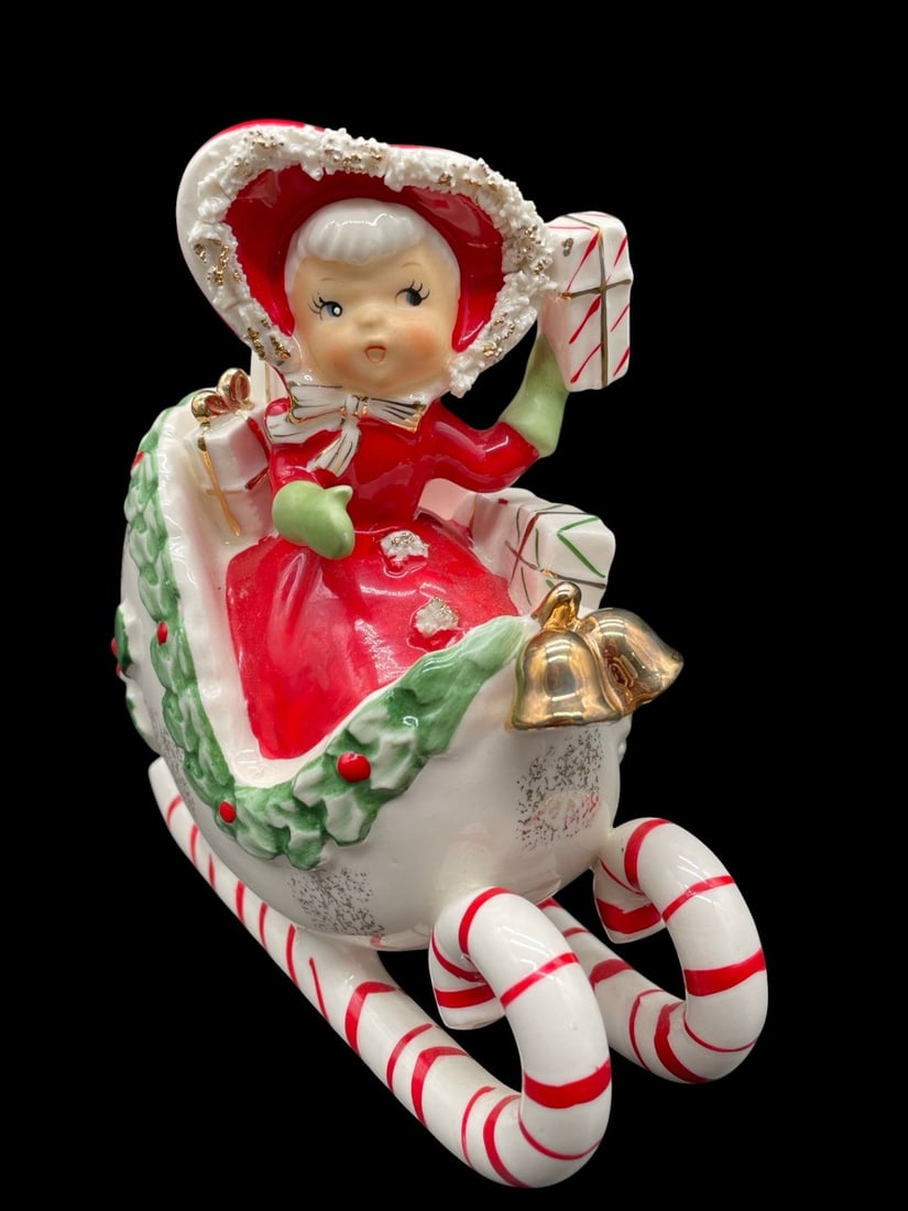 Vintage Napco Christmas Girl in Sleigh Candy Canes: Vintage Napco Christmas Girl in Sleigh Candy Canes. Figure is in overall good condition. Figure measures 5? tall