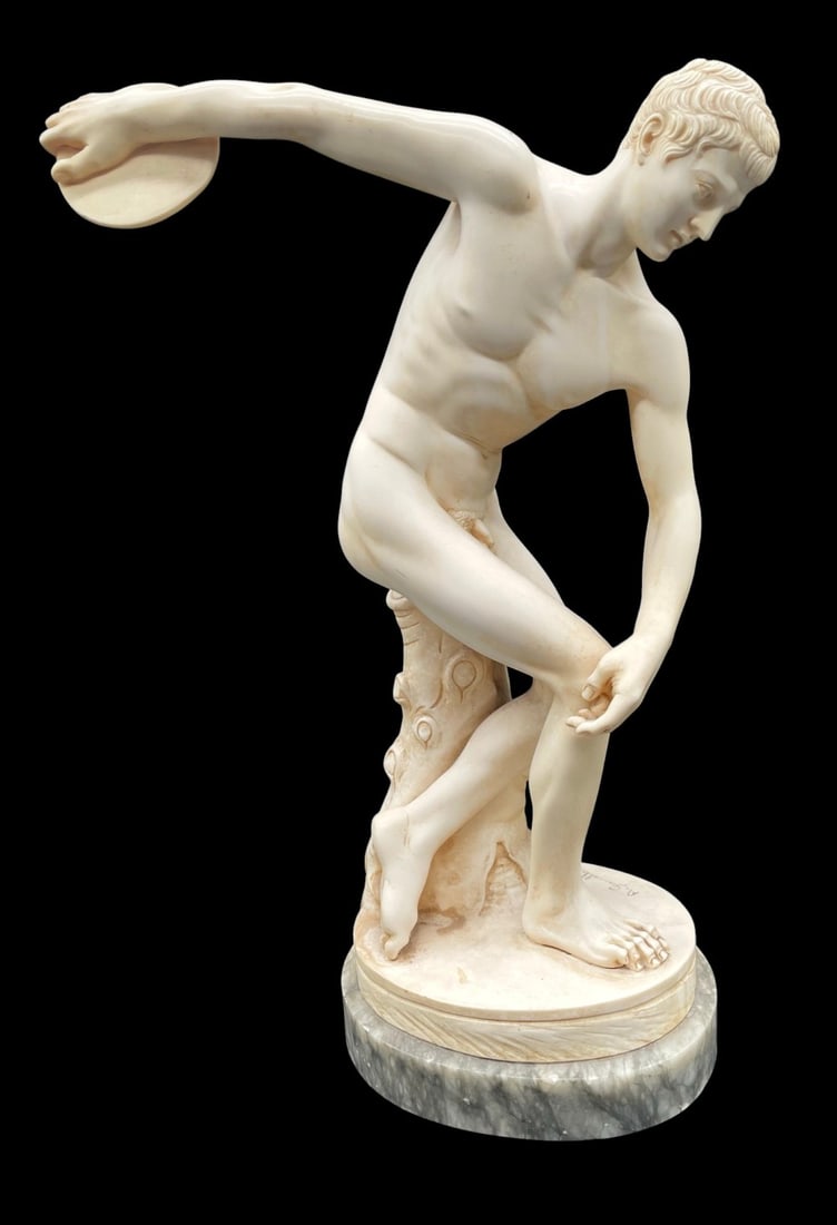 A.Giamelli Resin Discobolus Nude Greek Statue: A.Giamelli Resin Discobolus Nude Greek Statue. Statue is in overall good condition with some wear and marble base. Measures 18? tall