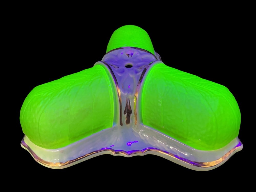 Art Deco Uranium Glass/Ceramic Ceiling Light: Art Deco Uranium Glass/Ceramic Ceiling Light. Ceiling Light is in overall good condition with chips on inside edges of Shades and Breaks on Edges and on Bottom. Measures 12? x 12? x 4 1/2