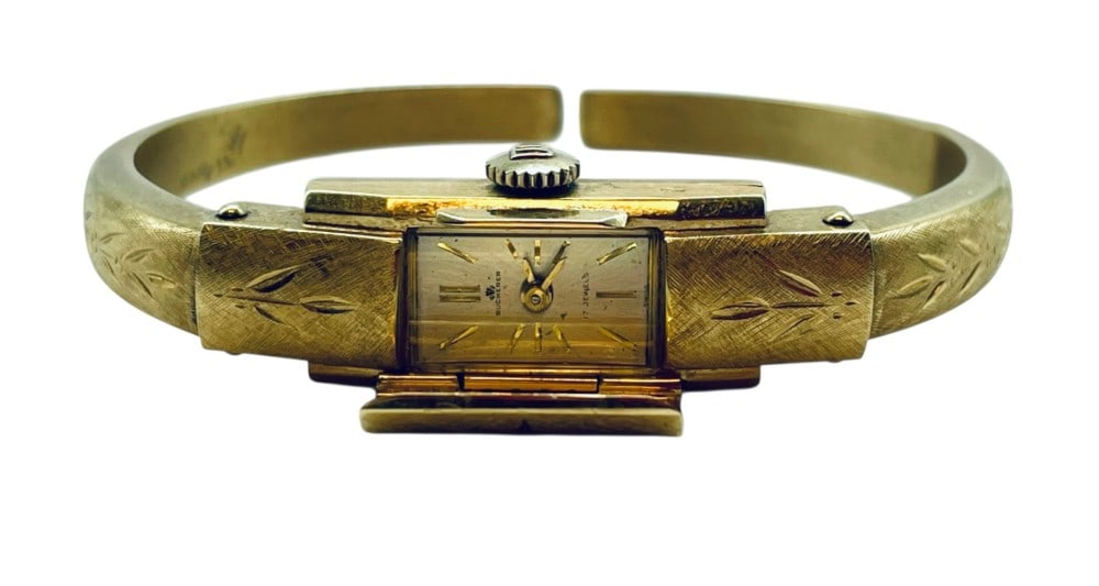 Bucherer 18K 750 Yellow Gold Ladies Cuff Watch: Bucherer 18K 750 Yellow Gold Ladies Cuff Watch. Weighs 13.9 grams 17 Jewel and Works. Approximately 2 1/4? and has dent on side.