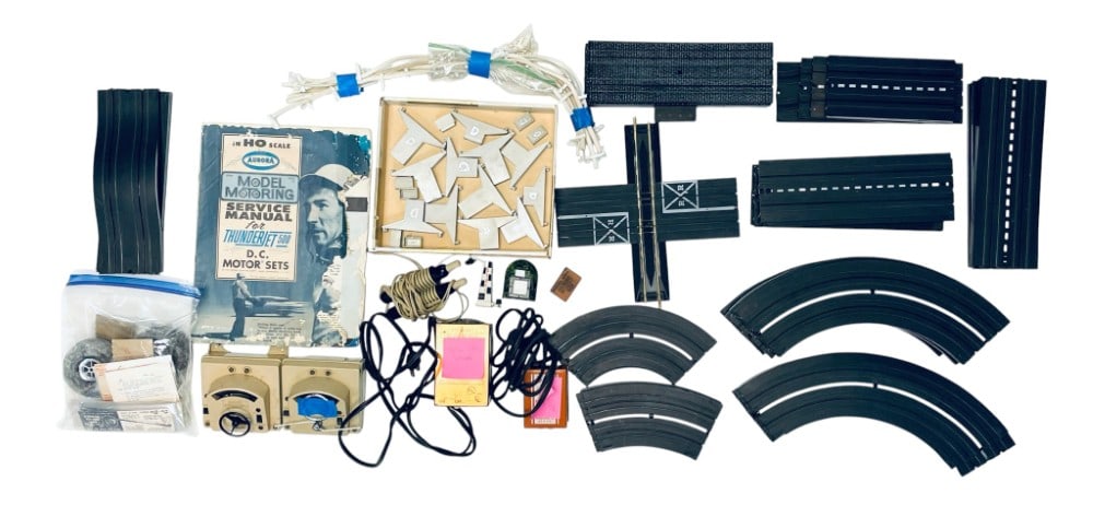 Slot Car Accessories and Tracks: Slot Car Accessories and Tracks. Curved Tracks, Power Packs, Trestle Parts. Manual is in Rough Condition and Speed Control is Untested.