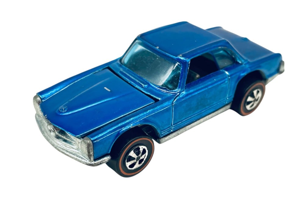 1969 Hot Wheels Mercedes Benz 280SL Red Line: The car has some scratches in the paint and wear on the edges.