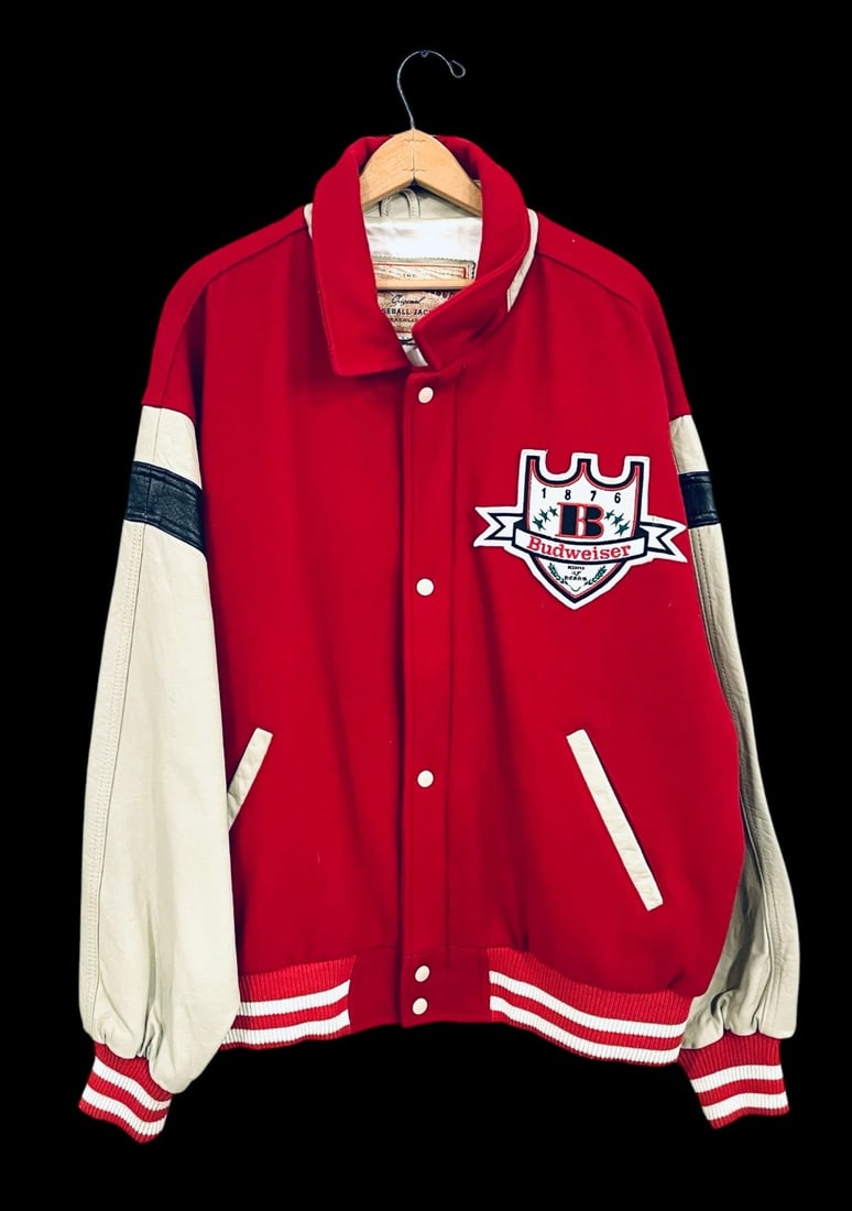 Budweiser King of Beers Wool/Leather Varsity Jacket: Budweiser King of Beers Wool/Leather Varsity Jacket. XXL Louisville Slugger Baseball Jacket. Jacket is in overall good condition with patches.