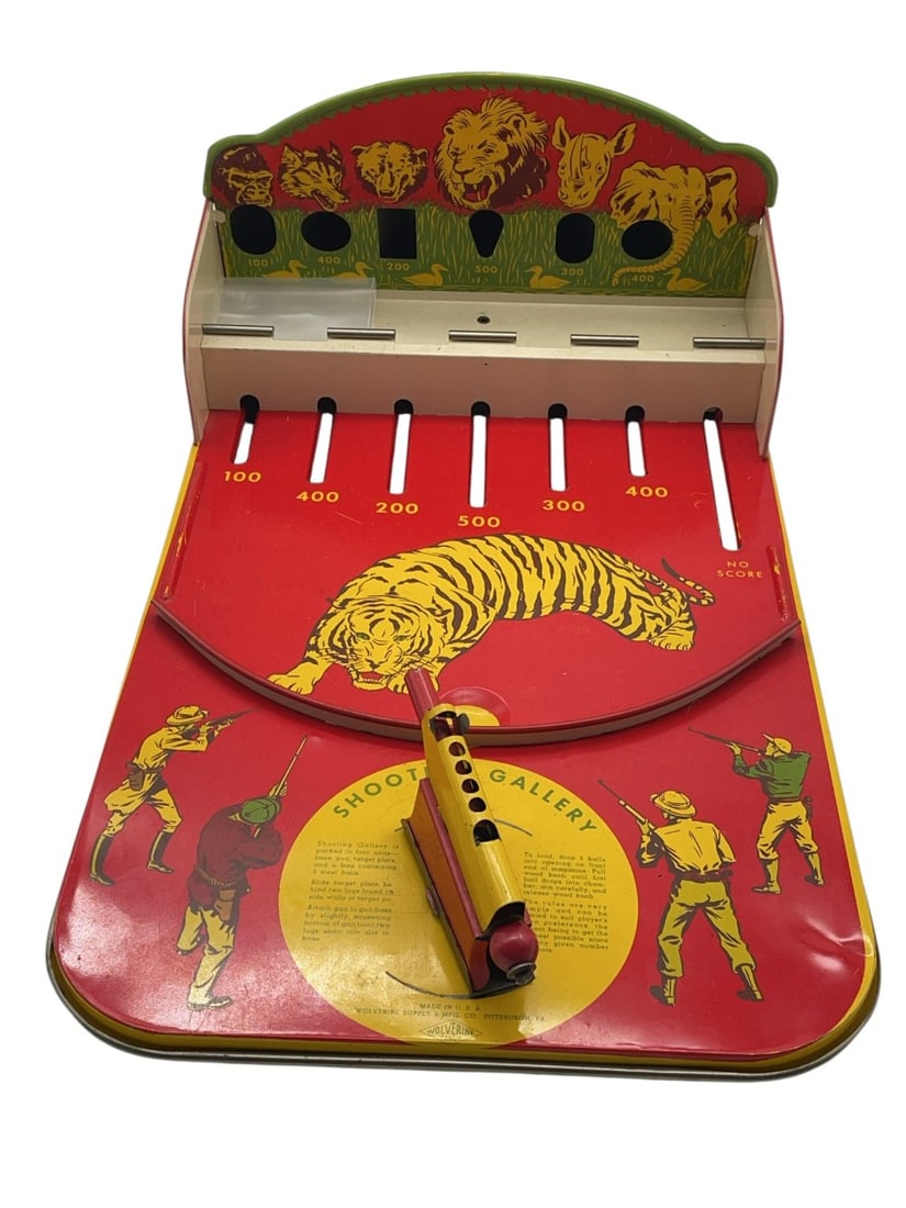 Vintage Wolverine Tin Litho Shooting Gallery Game: Vintage Wolverine Tin Litho Shooting Gallery Game. Shooting Gallery has dent on side and has Paint Chipping. Measures 18? x 11? x 7