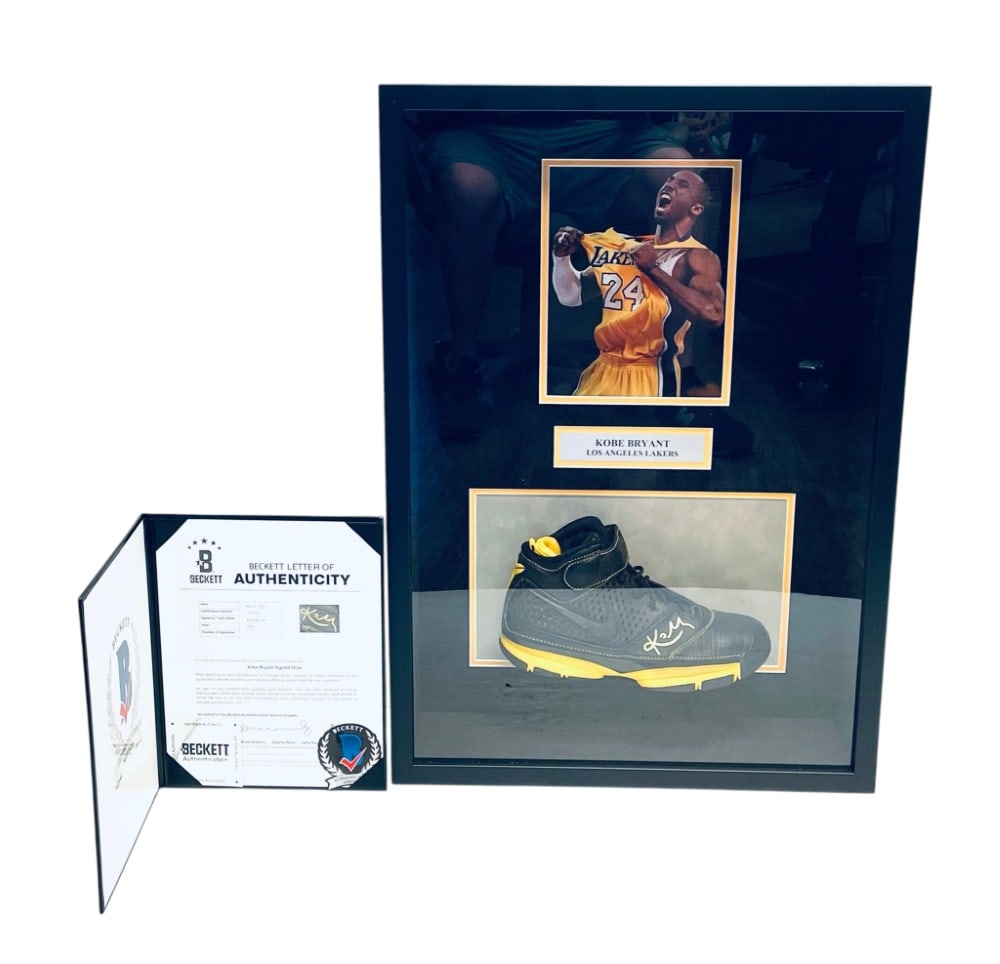 Kobe Bryant Signed Los Angeles Shoe: Kobe Bryant Signed Los Angeles Shoe. Shoe Signed in Gold Marker and Beckett Authenticated and Photo. Measures 19 1/2? x 5 1/2? x 27 1/2