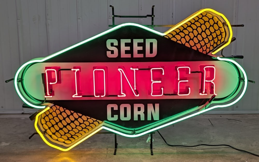 4ft Custom Pioneer Seed Corn Neon Sign: Large custom Pioneer Seed Corn Neon Sign. Appears to be in nice working condition with light wear from display and storage. It measures approximately 4ft across by 30in tall