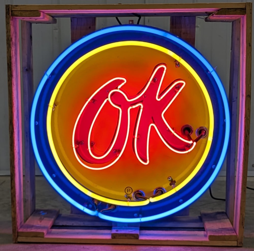 2ft Custom Chevrolet OK Used Cars Porcelain Neon Sign: Custom single sided porcelain OK Used Cars neon advertising sign. The sign features new neon glas, transformers, and wiring. On metal can with hanging brackets. Easily displayed and transported with w