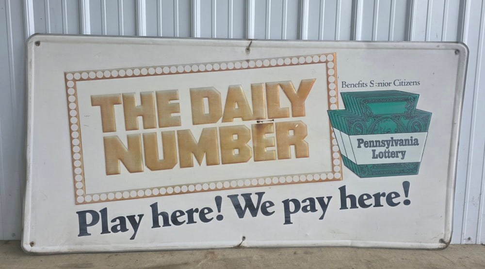 6' Vintage SST Embossed Pennsylvania Lottery Advertising Sign: Vintage SST Pennsylvania Lottery Advertising Sign. Has some scratches, fading and other wear from use and age. Displays well with nice graphics. Measures approximately 6' across x 35" tall.