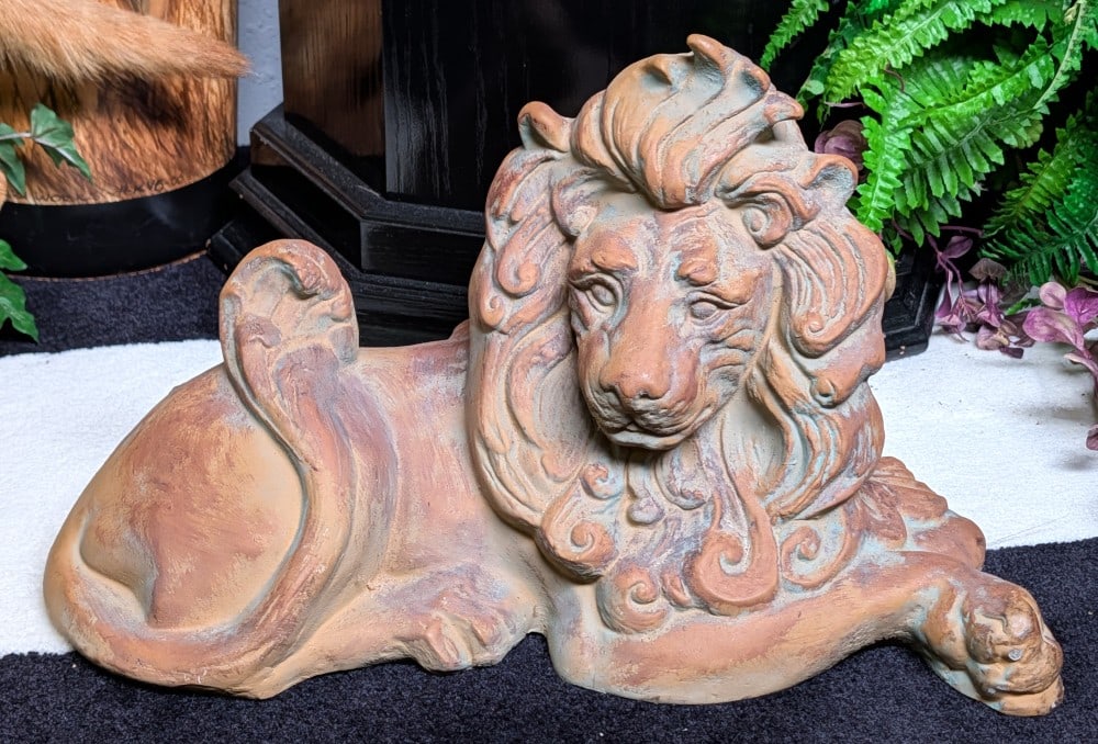 Resting Lion Stone Sculpture: Resting Lion Stone Sculpture. Piece is in very nice condition with minimal wear from display and age. Overall measures 19in wide x 10in deep x 12in tall.