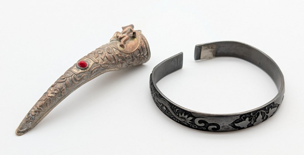Vintage Chinese Bangel Bracelet & Fingernail Guard: Vintage Chinese Bangel Bracelet & Fingernail Guard. Nail guard features stamped designs with a frog and a red stone. Bangel features an Asian dragon and rooster and is stamped with Chinese markings on