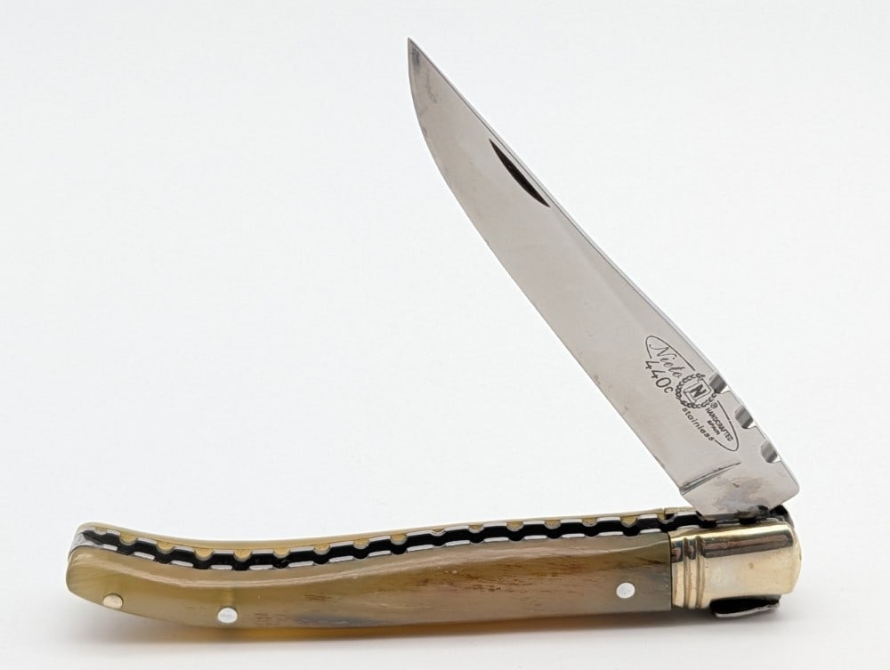 Spanish Nieto Rams Horn Folding Knife: Spanish Nieto Rams Horn Folding Knife. Features file work along the leaf spring and spacers, and has a bee pull release. Knife is in very nice condition with minimal wear from handling. Overall measur