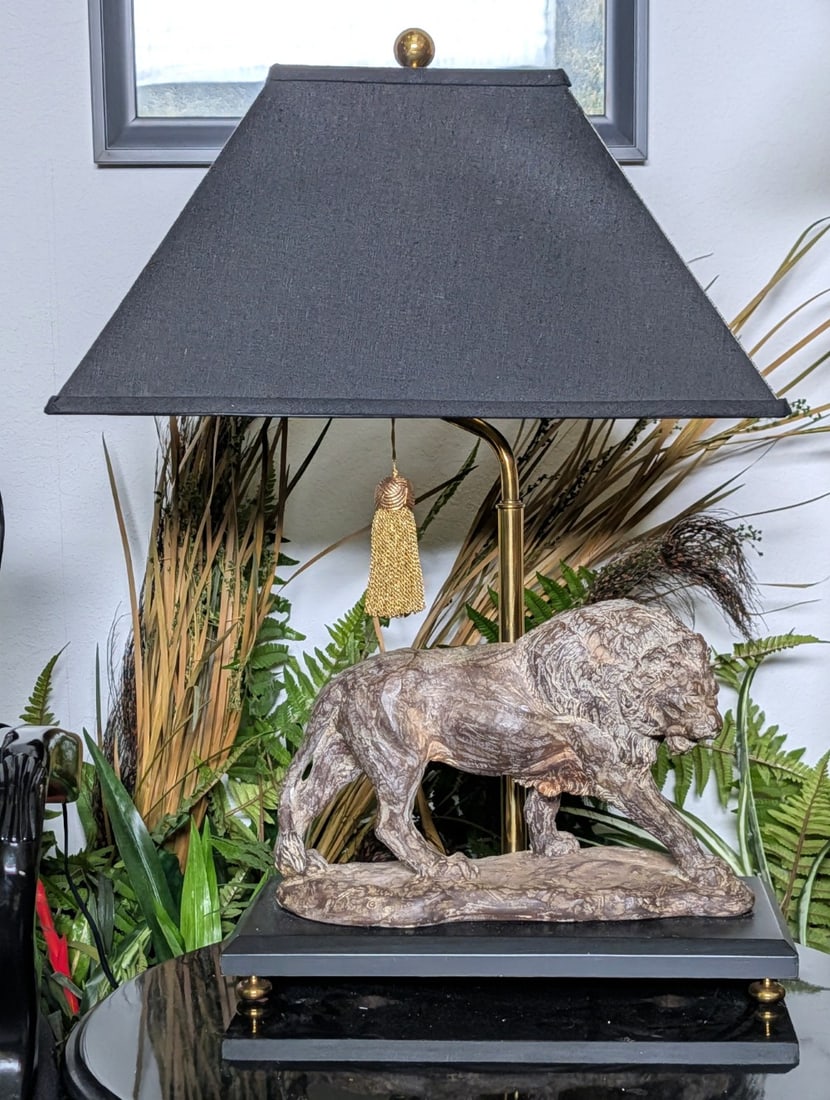 Walking Lion Table Lamp Signed Alva: Walking Lion Table Lamp Signed Alva. Lion is made of plaster. Lamp is in good condition, but the tail has been cracked. Overall measures 26in tall.