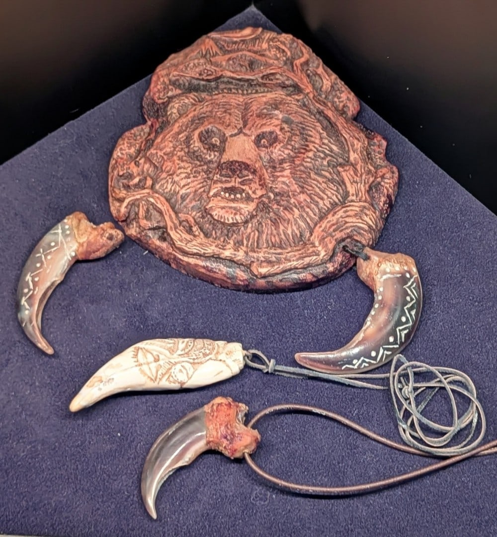 Carved Bear Tooth & Claw Decorative Piece & Necklace: Carved Bear Tooth & Claw Decorative Piece & Necklace. Carving feature native designs with a large bear carving medallion center piece.
