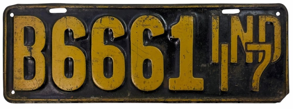 1917 Indiana Vehicle License Plate: 1917 Indiana Vehicle License Plate. This plate shows minimal damage but some rust on the face due to age. Overall this plate is in nice used condition. It also measures approximately 16" by 6".