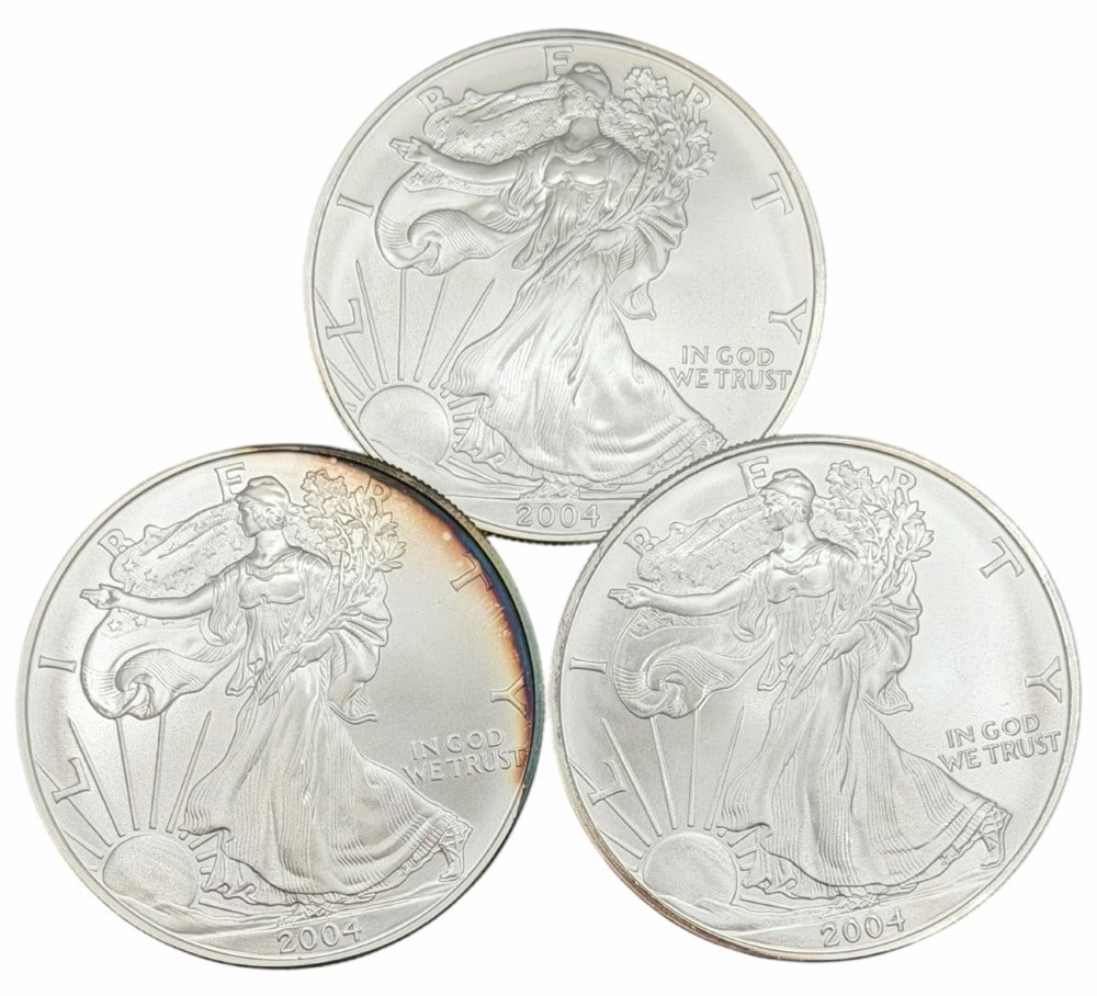 (3) 2004 United States Silver American Eagle One Ounce .999 Fine Silver Dollars, Uncirculated: (3) 2004 United States Silver American Eagle One Ounce .999 Fine Silver Dollars, these coins are uncirculated. ?Total weight 3 troy ounces of .999 fine silver