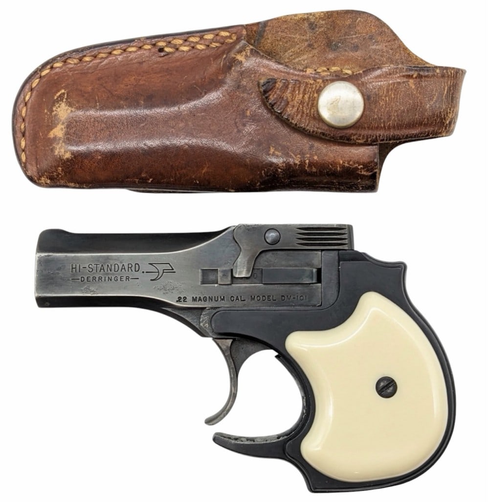 High Standard DM-101 .22 Mag 2-Shot Derringer w/ Holster: High Standard DM-101 .22 Mag 2-Shot Derringer w/ Holster.? The Hi-Standard is in nice used condition.? The derringer does show some wear marks from use.? Barrel measures 3.5 inches in length.? Grips a