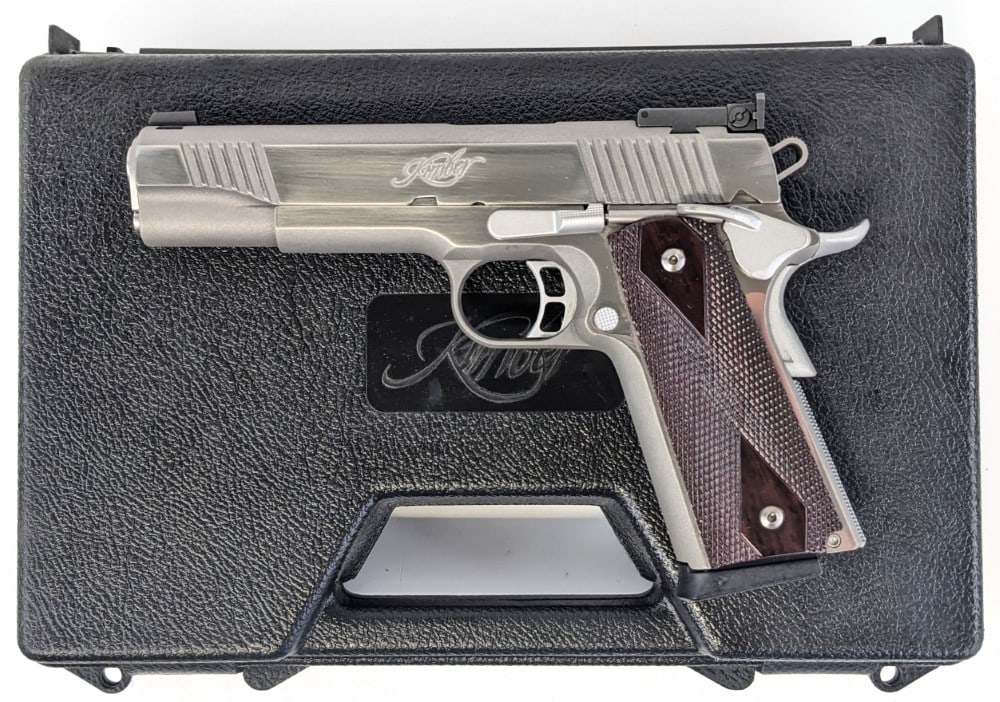 Kimber Classic Stainless Gold Match .45 ACP Semi Auto Pistol w/ Case: Kimber Classic Stainless Gold Match .45 ACP Semi Auto Pistol w/ Case.? The Kimber Classic stainless pistol is in very nice used condition.? The polished or chrome stainless finish looks new.? ?Comes i