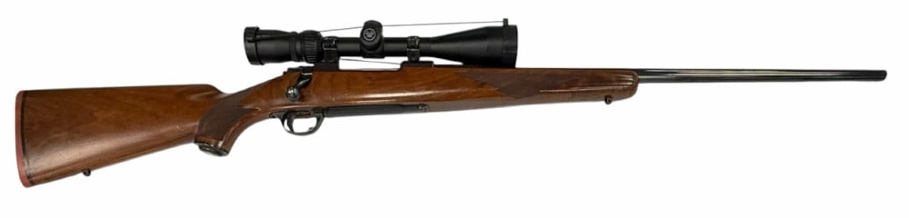 Ruger Model 77 .338 Win Mag Bolt Action Rifle with Scope: Ruger Model 77 .338 Win Mag Bolt Action Rifle with Scope.? The Ruger M77 .338 Win bolt action rifle is in very nice used condition.? Barrel measures 24 inches in length.? Blueing is strong, wood stock