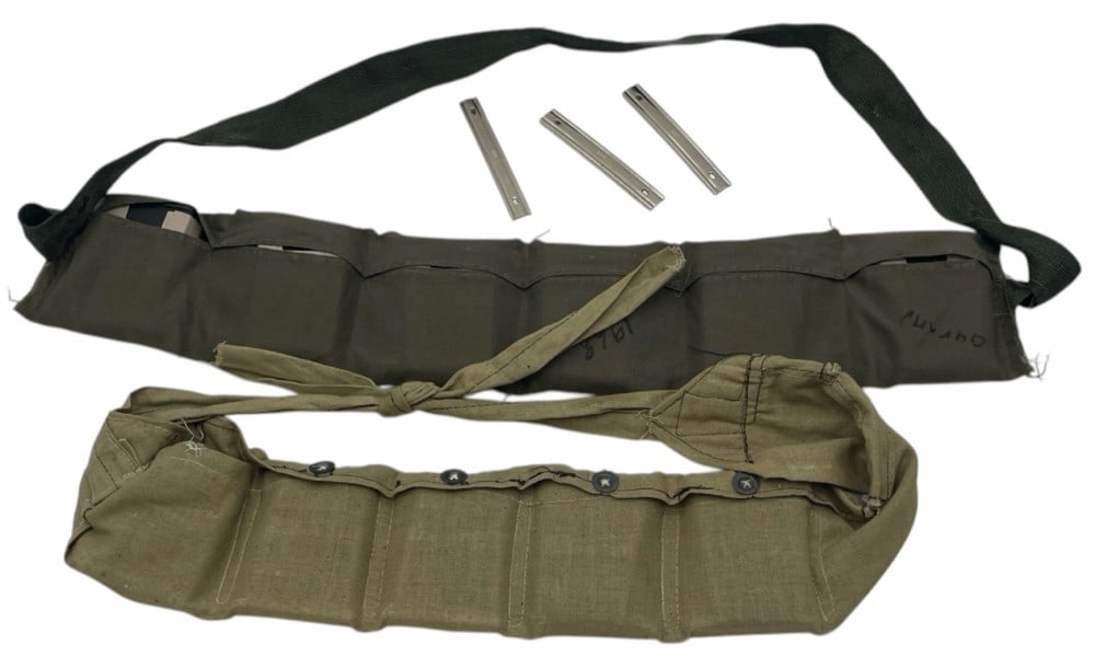 Military Rifle Bandolier and Ammunition: Military Rifle Bandolier and Ammunition. This lot is for one (1) 30-06 M1 Garand .30 Cal M2 Ball Bandolier 6 Clips, and 48 RNDS of ammunition and one 8mm Bandolier with Ten Stripper clips and 50 round