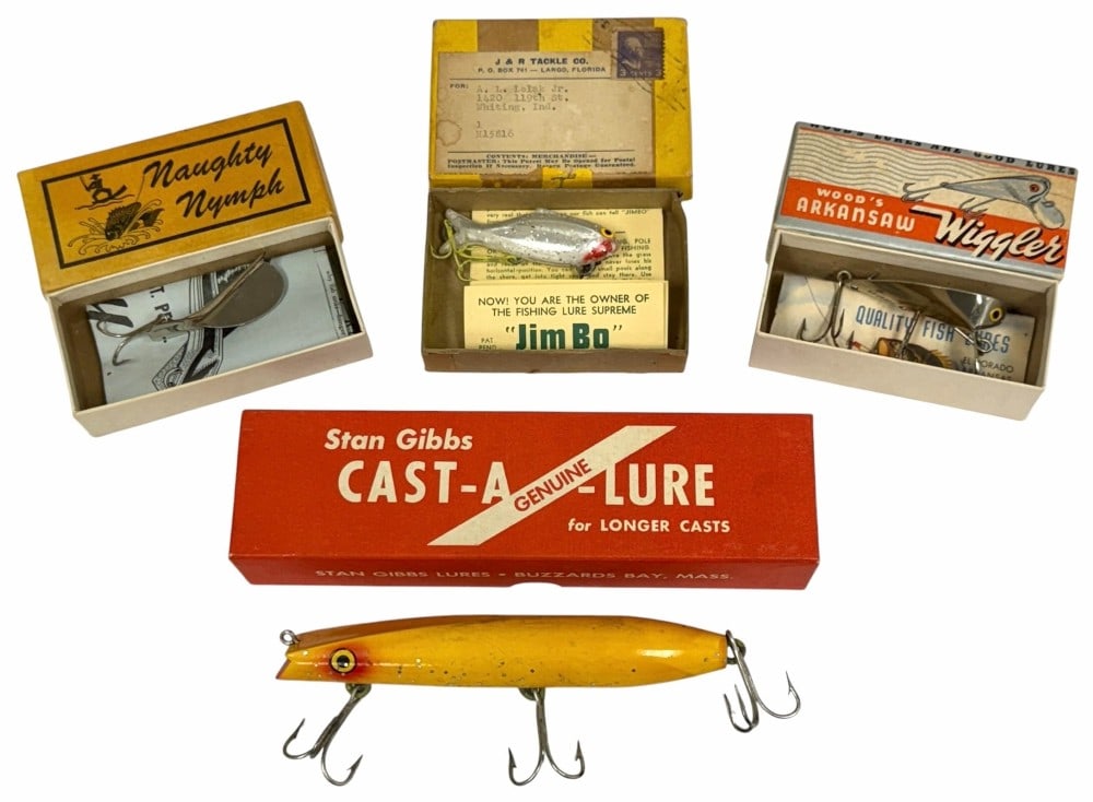 Stan Gibbs Cast-A-Lure, Naughty Nymph Lure, Wood's Arkansaw Wiggler, And J&R Tackle Co. Lure w/: Stan Gibbs Cast-A-Lure, Naughty Nymph Lure, Wood's Arkansaw Wiggler, And J&R Tackle Co. Lure w/ Boxes. Included are four various fishing lures with boxes. The following are included: Stan Gibbs Cast-A
