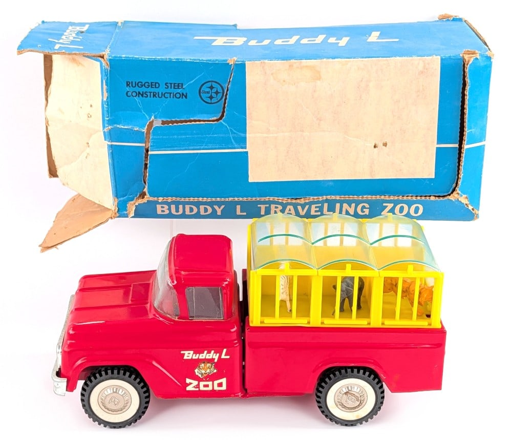 Buddy L No. 5420 Traveling Zoo Truck w/ Box: Original Buddy L No. 5420 Traveling Zoo truck with original box. The truck is complete with all six animals and cage. The rear clear window portion on the truck is cracked. The truck shows some box ru