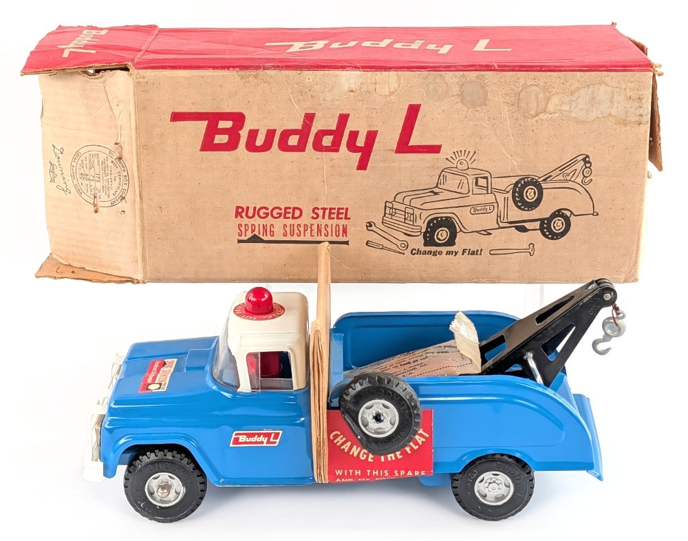 Buddy L No. 5427 Flat Tire Wrecker Truck with Flasher in Box: Original Buddy L No. 5427 flat tire wrecker truck with flasher light in the original box. The truck is like new old stock / never played with. It still has the hang tag on the spare tire, spring suspe