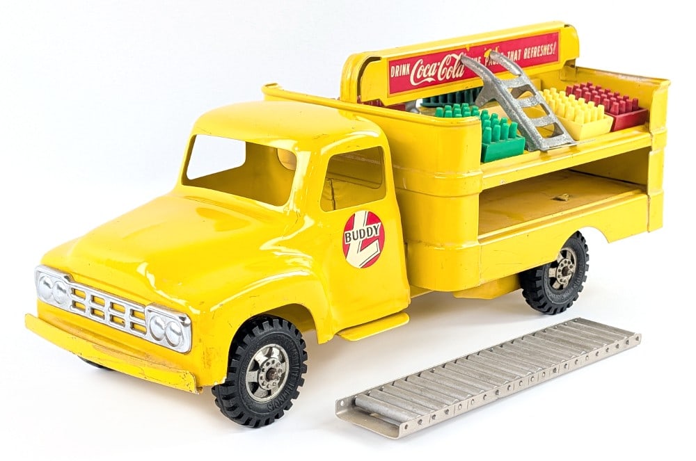 Buddy L Coca-Cola Delivery Truck: Original Buddy L Coca-Cola delivery truck. The truck shows some light paint loss and light decal loss. It comes with the plastic crates, two dolly's, and conveyor. Measures approximately 15" long.?