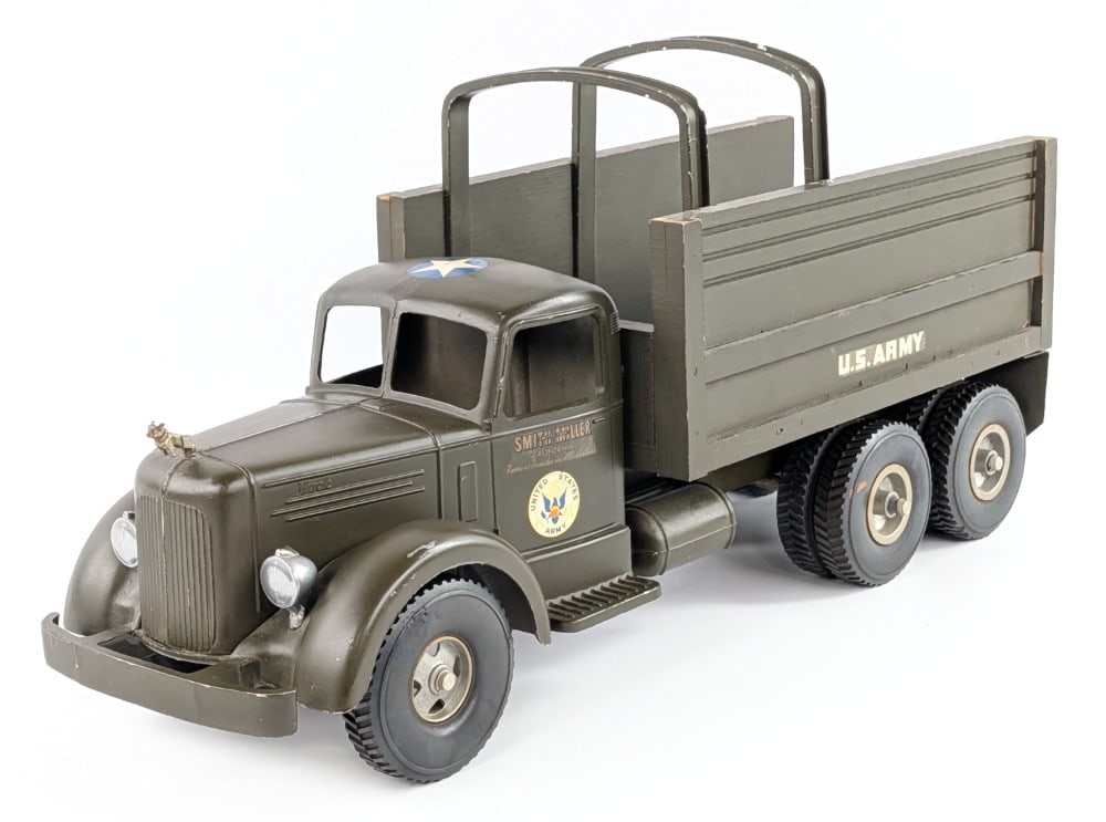 Smith Miller U.S. Army Truck: Original Smith Miller U.S. Army cargo transport truck. The truck has a small scratch on the driver side fender and minor paint loss. Overall very good condition. Measures approximately 19" long.