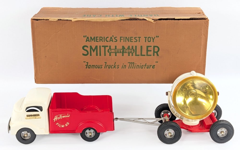 Smith Miller GMC Hollywood Film-Ad Truck w/ Searchlight & Box: Original Smith Miller GMC Hollywood Film-Ad truck with searchlight in the original box. The truck has some rub marks, but is in overall very good condition. The two main flaps on the top of the box