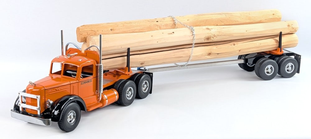 Fred Thompson Smith Miller L Mack Log Hauler Truck: Fred Thompson Smith Miller L Mack log hauler truck with log load. The truck displays well painted in orange overall with black accents and chrome features. Very good condition in the foam lined box.