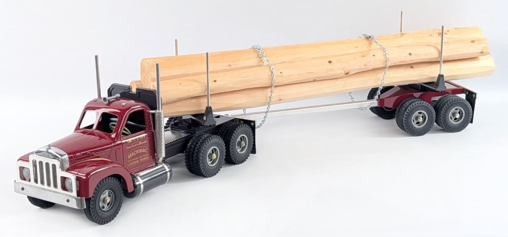 Fred Thompson Smith Miller Mackinac Logging Works B Mack Log Truck: Fred Thompson Smith Miller B Mack Mackinac Logging Works truck and trailer with log load. The truck and trailer come in the foam lined shipping box and have the load of logs. Displays well with load o
