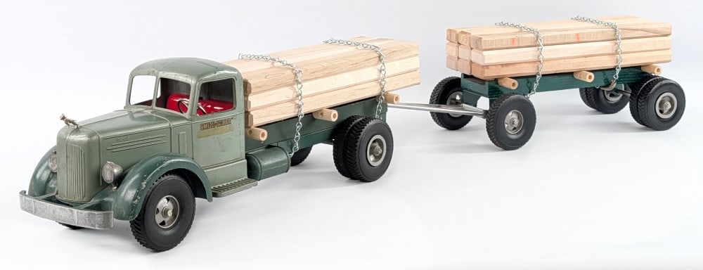 Smith Miller L Mack Lumber Hauler Truck with Trailer: Smith Miller L Mack lumber hauler truck with pup trailer. The truck has a replacement Bulldog hood ornament, lumber load, and rear hitch. The truck does show original paint with some wear from play / 