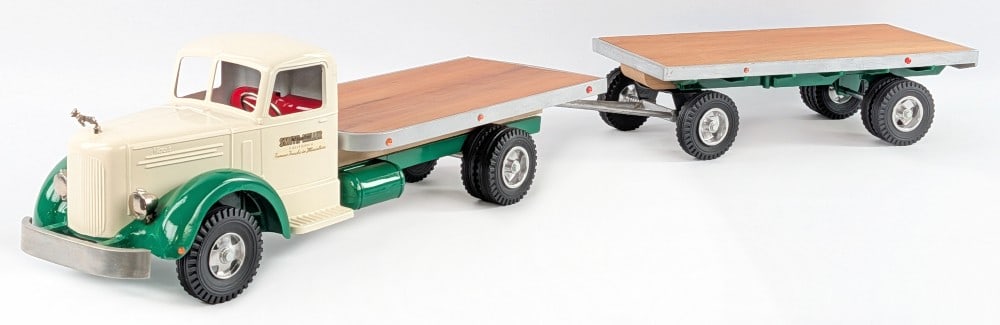 Custom Smith Miller L Mack Flatbed Truck with Pup Trailer: Custom Smith Miller L Mack flatbed truck with pup trailer. The truck has a custom wood flatbed, custom white and green paint job, reflectors, and Bulldog hood ornament. The bumper was replaced when cu