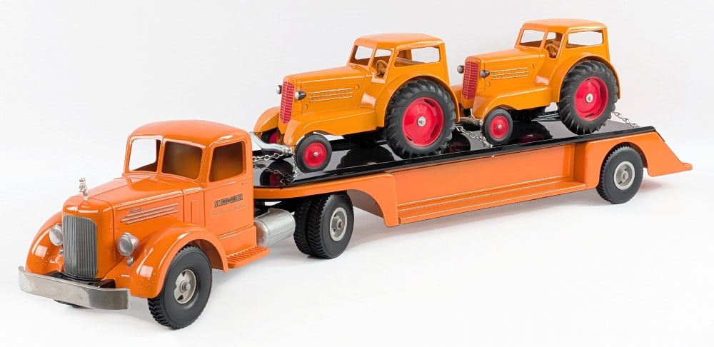 Custom Smith Miller L Mack Truck with Minneapolis-Moline UDLX Loaded Trailer: Custom Smith Miller L Mack truck with flatbed trailer carrying (2) Minneapolis-Moline UDLX tractors. Displays well painted in orange overall with Mack Bulldog hood ornament, and two UDLX tractors secu