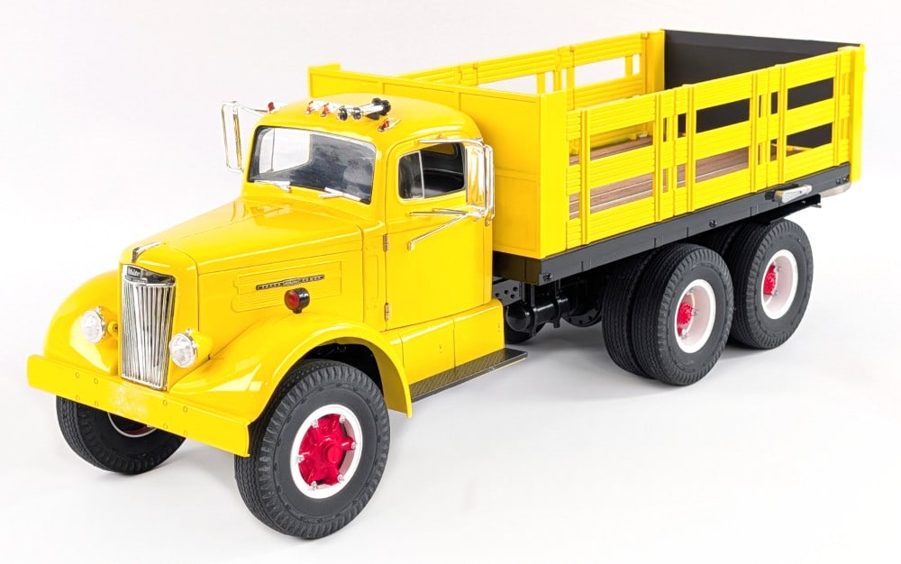 White WC-22 Stake Bed Truck: Fumby Street Motors White WC-22 stake bed truck. Mostly made of die-cast metal. A highly detailed replica. Good condition and comes with the box. Measures approximately 19" long.