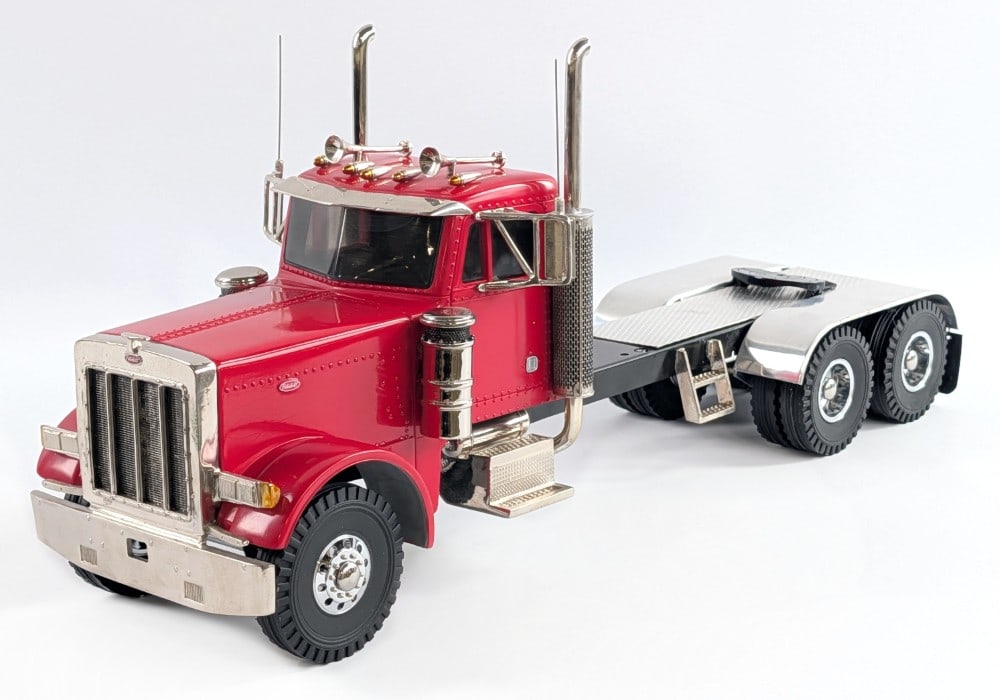 M&J Custom Peterbilt Semi Truck - Red: M and J custom Peterbilt semi truck. The truck shows some minor paint crazing and dust from being on display. The cab is resin with a metal frame and other metal parts. Overall a very nice detailed cu